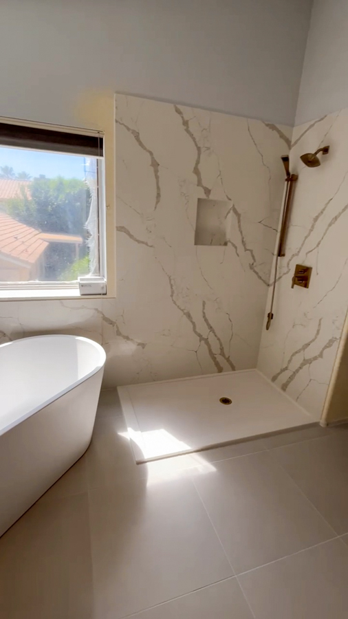 Master bathroom with freestanding tub and modern fixtures