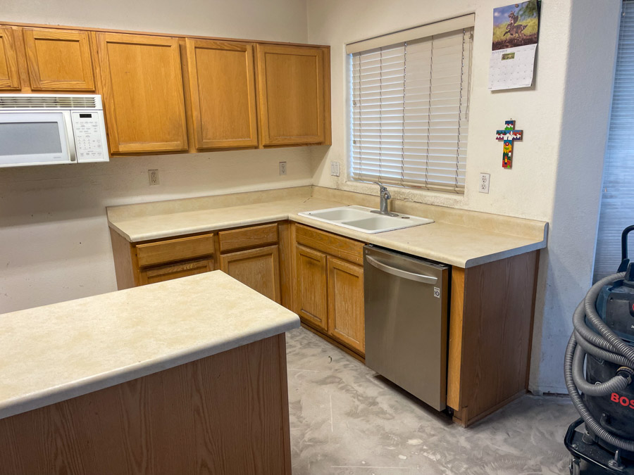 A dated builder-grade oak kitchen before an Orange Cactus remodel, the kind of layout common in 2000s East Valley homes